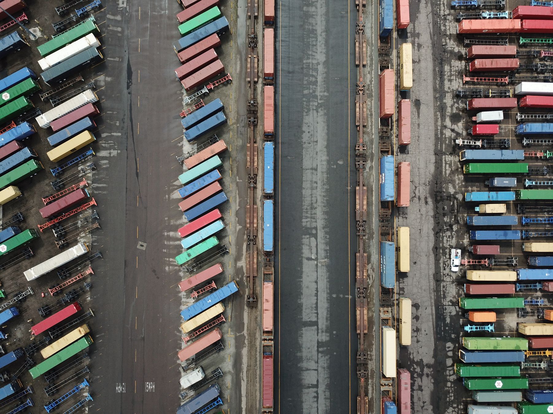 Straight-down aerial view of an intermodal container yard