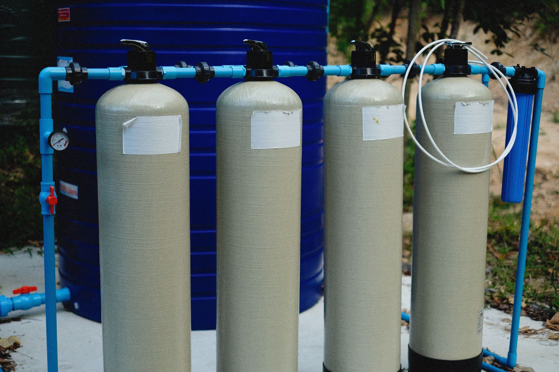 Outdoor water treatment tanks with blue process piping